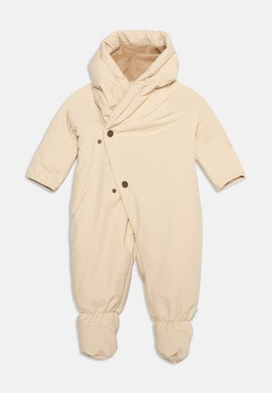 Beige one-piece baby snowsuit with hood, long sleeves, snap buttons, and foot coverings, lined with soft brown fabric inside.