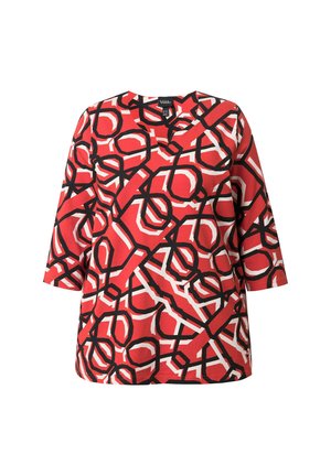 Top tunica rosso con motivi geometrici in bianco e nero. Presenta maniche a tre quarti e scollatura a V. Realizzato in tessuto leggero.