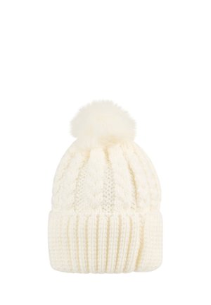 Cream-colored knitted winter hat with cable pattern, folded brim, and fluffy pom-pom on top.
