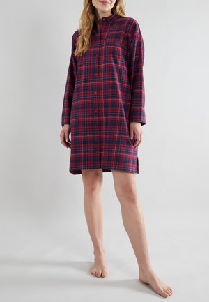 Abito camicia a quadri rosso e blu con colletto, maniche lunghe, fessure laterali e vestibilità rilassata. Realizzato in un tessuto morbido.