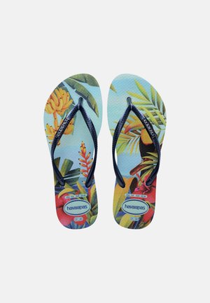 Een paar Havaianas slippers met zwarte bandjes en kleurrijke tropische bladeren- en bloemenpatronen op de zolen, maat 37-38 EU.