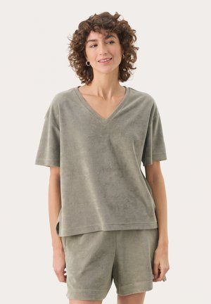 Light green, short-sleeve V-neck top made of soft fabric, featuring a loose fit and side slits, paired with matching shorts.