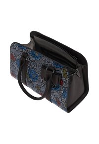 Sac en tissu à motif floral avec accents en cuir foncé, fermeture éclair, deux poignées et compartiments intérieurs pour l'organisation.