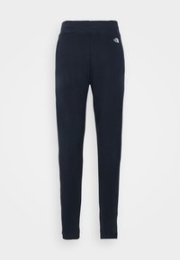 Černé elastické kalhoty s žebrovaným pasem, s malým logem na horní levé noze, hladkou texturou a zúženým střihem.