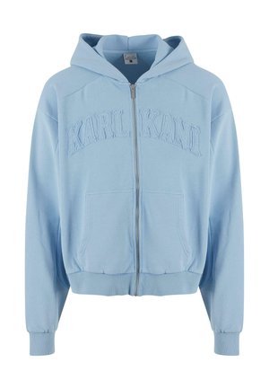 Light blue zip-up hoodie made of soft fabric, featuring a large embroidered "KARL KANI" logo on the chest, front pockets, and ribbed cuffs.