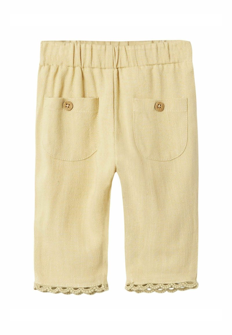 Pantaloni gialli in lino con una vita elastica, due tasche posteriori e un bordo in pizzo. Tessuto textured con una finitura morbida.