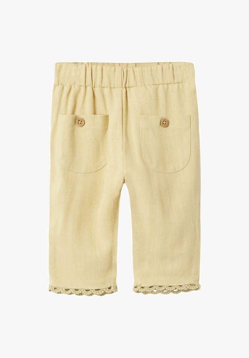 Pantaloni gialli in lino con una vita elastica, due tasche posteriori e un bordo in pizzo. Tessuto textured con una finitura morbida.