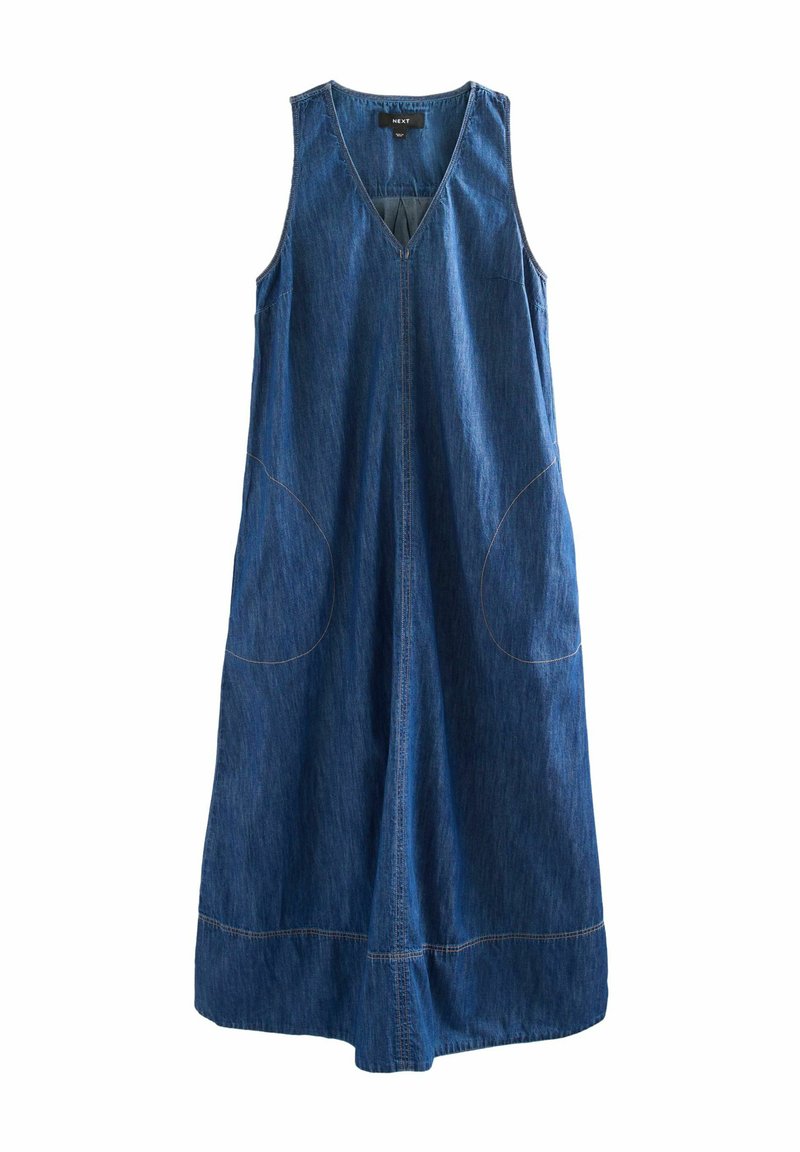 Denimklänning med V-hals, ärmlös design och stora sidfickor. Har kontrasterande sömmar, lös passform och medellång silhuett.