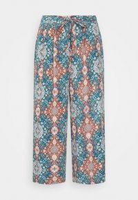 Pantalons à imprimé floral en tissu turquoise avec des motifs en diamants orange et bleu, jambes larges et taille à nouer.