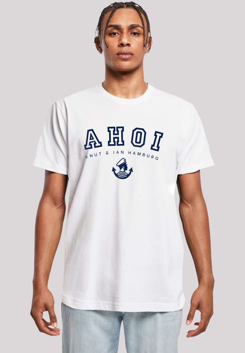 White cotton t-shirt featuring a navy graphic with "AHOI" text and an anchor design. Relaxed fit, short sleeves, crew neck style.