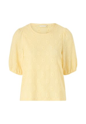 Lysegul bluse med korte ærmer, puffede ærmer og diamantmønstret hulbroderi.