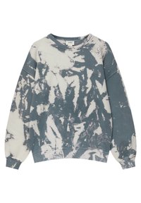 Sweat-shirt à col rond avec motif tie-dye bleu et blanc et texte « A TRIP ABROAD » imprimé au centre sur le devant.