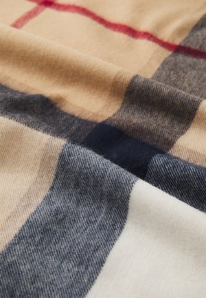 Wool blanket featuring a plaid pattern with beige, navy, and light gray sections, soft texture, and smooth finish.