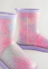 Colorful, translucent boots with a fluffy pink and purple texture, and a lilac rubber sole with a ridged pattern and pull tab.