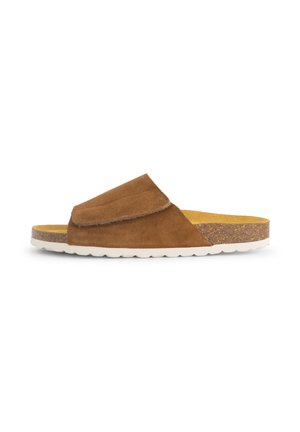 Brown suede slip-on sandal with white ridged sole and cork midsole, featuring a wide adjustable strap over the top.