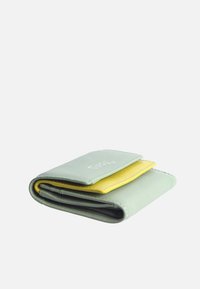Folded wallet made of smooth, mint green leather with a yellow accent piece. Features stitched edges and embossed logo on the front.