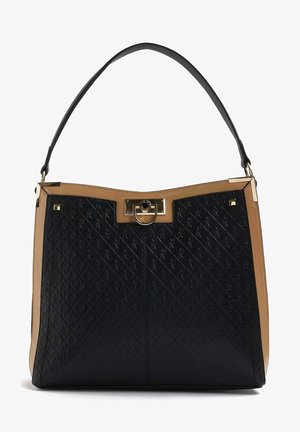 Sort og tan tote bag med et struktureret, prægning mønster og guld hardware. Den har en struktureret form og en enkelt sort skulderrem.