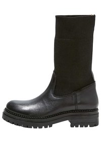 Svarta ankelskor med en slät läderfot och ribbad tygskafte, med en tjock sula och sidostretchpaneler för enkel påtagning.