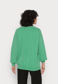 BDG Urban Outfitters COLORADO SPRINGS CREWNECK - Sweatshirt - green