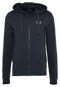 Námořnická mikina na zip vyrobená z bavlněné směsi s ribbed manžetami a lemem. Obsahuje kapuci se šňůrkou a logo EA7 na hrudi. Hladká textura.