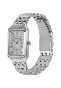 Montre Fossil rectangulaire argentée avec un bracelet métallique, un cadran en nacre, des index en chiffres romains et des cristaux d'accent autour de la lunette.