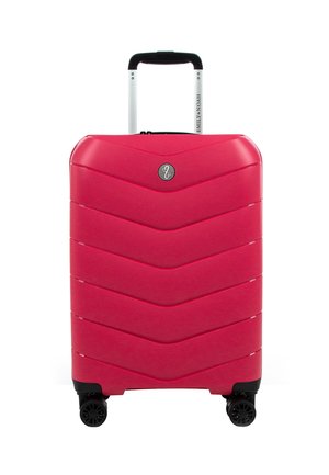 Hard-shell suitcase in vibrant pink, featuring a chevron pattern, retractable handle, and four 360-degree spinner wheels for easy mobility.