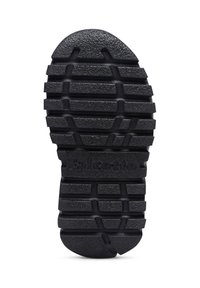 Suola nera in gomma con un motivo testurizzato di scanalature orizzontali e verticali. Presenta la parola "Falcotto" impressa vicino al tallone.