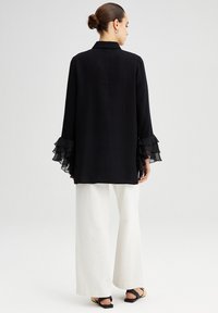 Touché Privé FRILLY ARMED  - Tunika - black