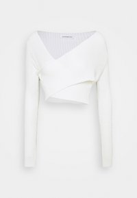White cropped sweater with a deep V-neck, long sleeves, and a textured knit design. Features a wrapped front detail for an asymmetrical look.