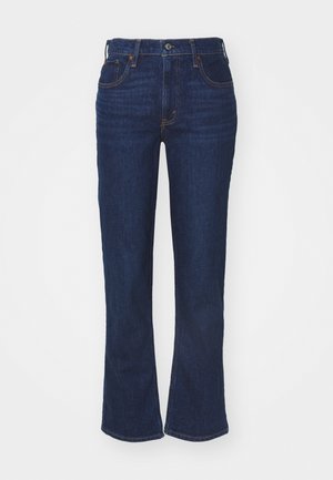 Dark blue denim flared jeans with a high waist, five-pocket design, contrasting stitching, and a button closure. Smooth texture.