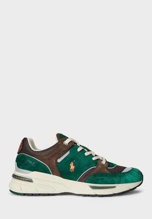 Tumed nahk ja võrgusneaker tumesinises ja pruunis, mida täiendab koorevärvi vahepealne tald, heledad hallid detailid ja õrn logo külgedel.