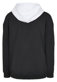 Fekete kapucnis pulóver fehér béléssel, oversize kialakítás, bordás mandzsettákkal és aljjal, puha pamutkeverék anyagból készült. Egyszerű és funkcionális.