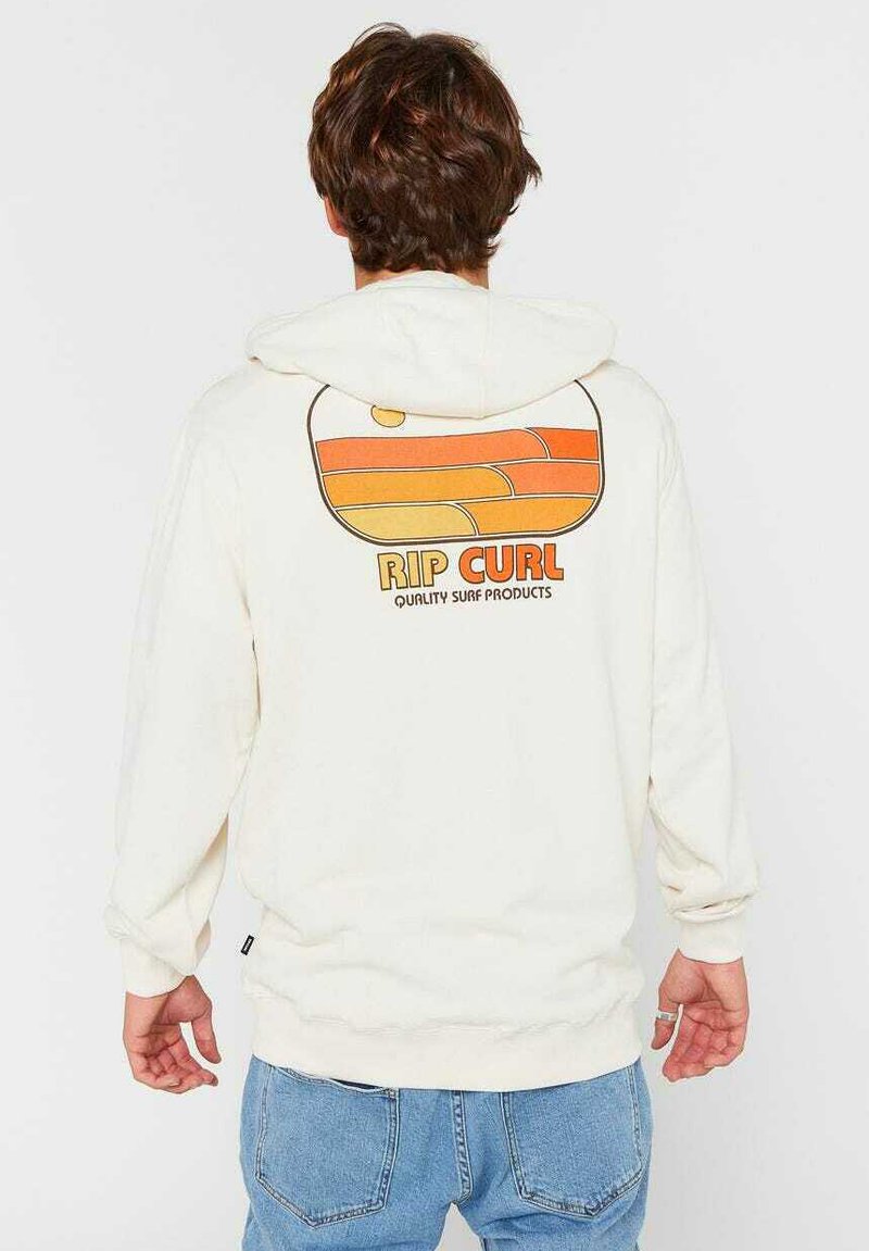 Kremowa bluza z kapturem wykonana z mieszanki bawełny, z kolorowym retro nadrukiem na plecach z napisem "RIP CURL". Luźny krój z regulowanym kapturem.