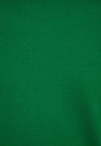 Bright green fabric with a smooth texture and a consistent ribbed pattern, showcasing a uniform color without visible patterns or accents.