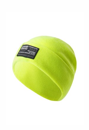 Neon yellow knitted beanie featuring a black brand label with white text. The design includes a ribbed texture and smooth finish.