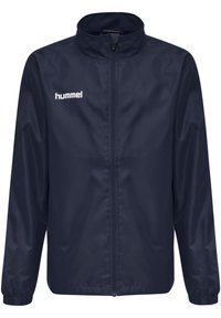 Marine windbreaker jas gemaakt van glad, waterbestendig materiaal. Heeft een rits aan de voorkant en elastische manchetten. Hummel-logo op de borst.
