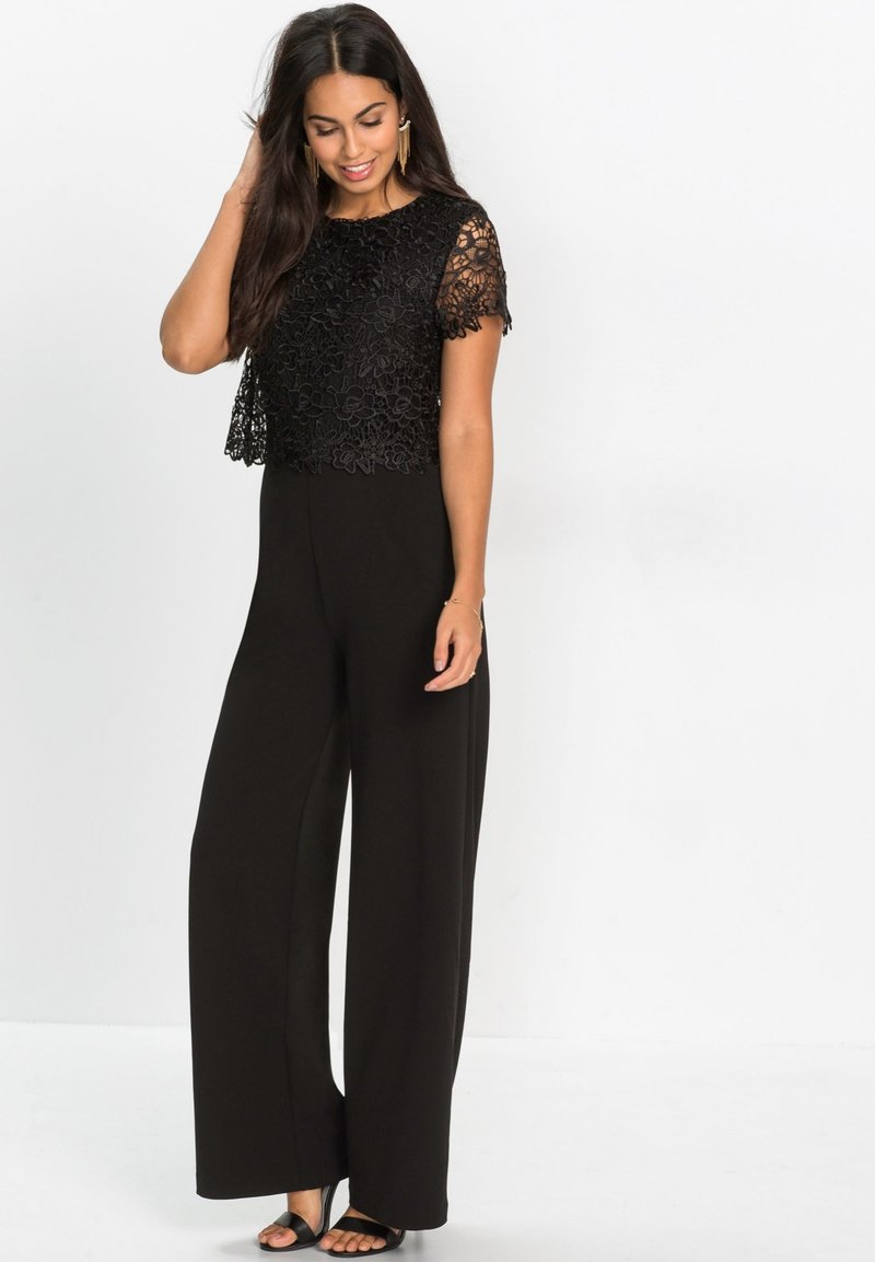 bonprix MIT KURZÄRMLIGER Jumpsuit schwarz Zalando.ch