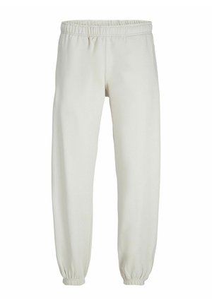 Pantalons de survêtement blancs en tissu doux, avec une taille et des poignets élastiques, présentant une texture lisse et un design ample.