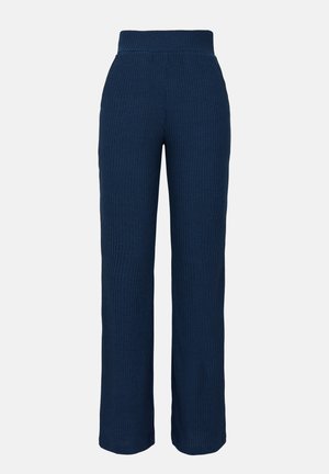 Mørkeblå ribstrikkede bukser med bred, elastisk talje og lige ben. Den bløde tekstur øger komforten og pasformen.
