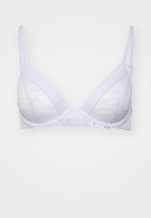 White triangular bra with a textured lace overlay. Adjustable straps and soft cups. Features a smooth back band and minimal hardware.