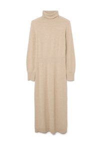 Vestido de punto en color beige con cuello alto, mangas largas y aberturas laterales. Textura suave con cintura ajustada y falda fluida.
