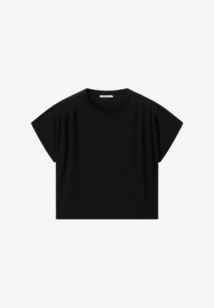 Blouse noire à manches courtes avec col rond et légers plis près des épaules, posée à plat sur un fond blanc.