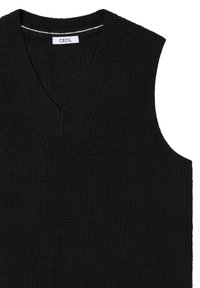 Schwarzer ärmelloser Pullover mit strukturiertem Strickmuster, V-Ausschnitt und gerippten Kanten. Etikett mit der Aufschrift "CECIL" in Weiß.