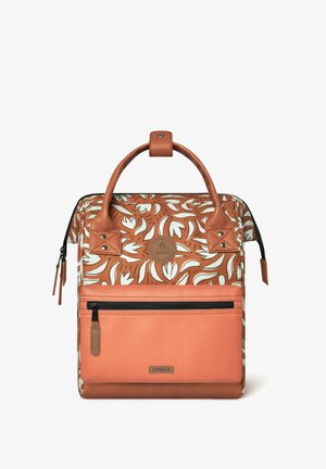 Leather and fabric backpack with orange hues and white floral patterns. Features dual handles, a front zipper pocket, and logo detail.