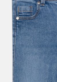 ONLY GIRLS KMGROYAL SWEET FLARE PIM - Flared Jeans - light blue bleached denim