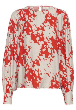 Langarm blouse van lichtgewicht stof, voorzien van een rood-wit abstract patroon. Hoge halslijn met een sluiting aan de achterkant en een geraffineerd detail op de mouwen.