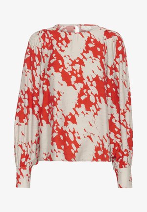 Langarm blouse van lichtgewicht stof, voorzien van een rood-wit abstract patroon. Hoge halslijn met een sluiting aan de achterkant en een geraffineerd detail op de mouwen.