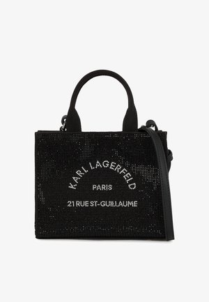 Czarna prostokątna torebka z górnymi uchwytami i odpinanym paskiem, ozdobiona kryształkami układającymi się w napis "KARL LAGERFELD PARIS 21 RUE ST-GUILLAUME."