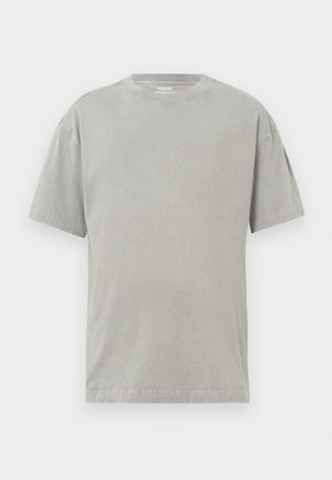 Grijze katoenen t-shirt met een ronde hals, korte mouwen en een ontspannen pasvorm. Zachte textuur met een subtiele, egale kleur.