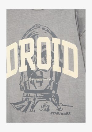 Sweat-shirt gris avec un grand graphisme de la tête du droïde C-3PO de Star Wars et un texte crème en gras épelant partiellement "DROID".